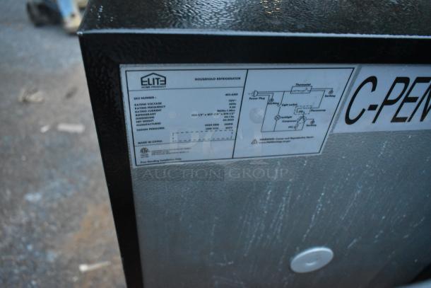 Alt text: "Elite household mini cooler model 453-6355 label detail, showing specifications such as 115 volts, 60Hz."