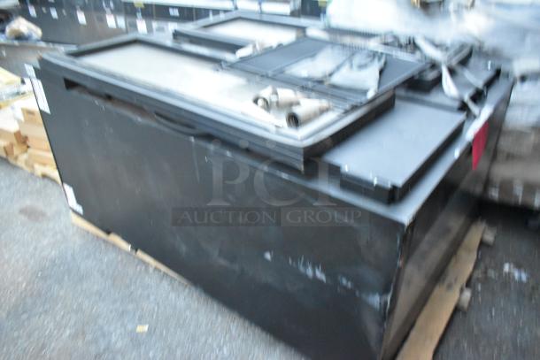 Metal Commercial 2 Door Reach In Cooler with black finish. Appears in used condition with visible wear. No visible labels.