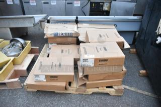 20 brand new scratch and dent items, including Cambro 1216514 Fiberglass Camtray boxes on pallets, suitable for customization.