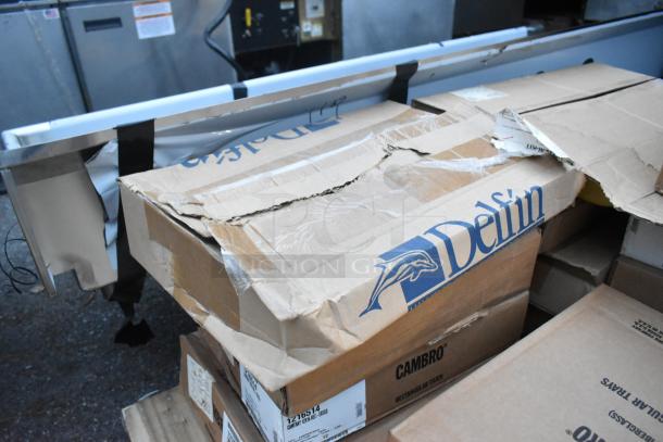 20 new scratch and dent items, including Cambro 1216514 trays, in damaged boxes. Fiberglass, earthen gold.