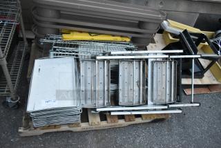 Three pallets with a ladder, mop bucket, metal baking pans, and storage trays. Mixed items for auction, good condition.