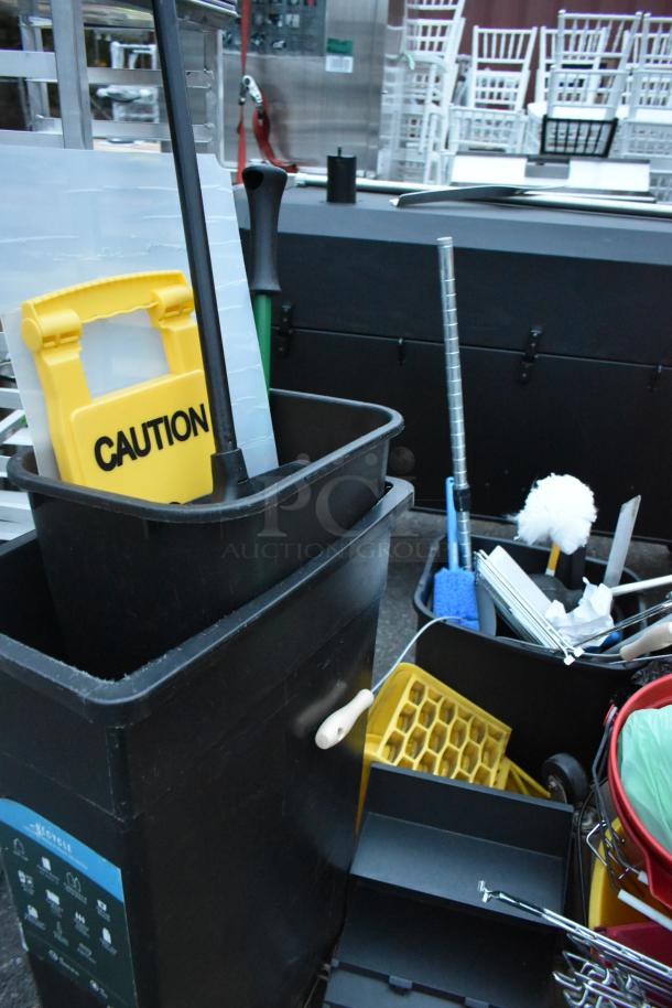 Three pallets of various items including a ladder, mop bucket with caution sign, and metal baking pans. Various conditions.