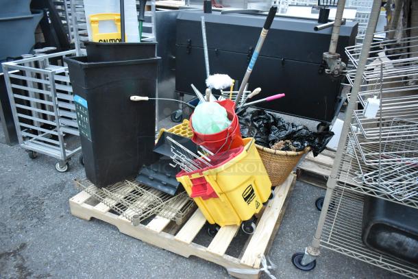 Three pallets with ladder, mop bucket, metal baking pans, and assorted items. Mixed condition. Multipurpose auction lot.