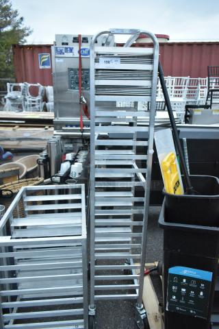 Winholt metal commercial pan transport rack with 11 shelves on commercial casters, labeled "198" for auction.