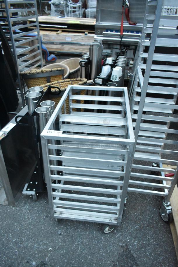 Metal commercial double pan transport rack with commercial casters, visible ID tag "199", durable metal frame.