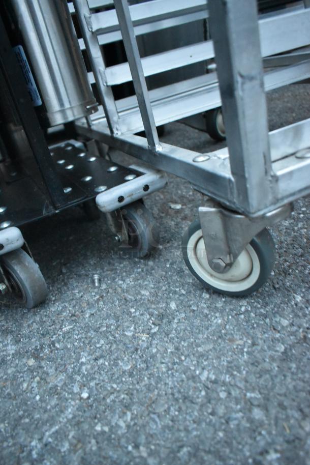 Metal commercial double pan transport rack on commercial casters. Durable design, metal frame, suitable for heavy-duty use.