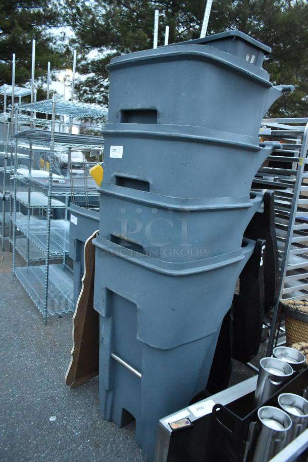 Stacked blue poly trash cans, slight wear, auction label 201. Durable for commercial use. Set of four per bid.