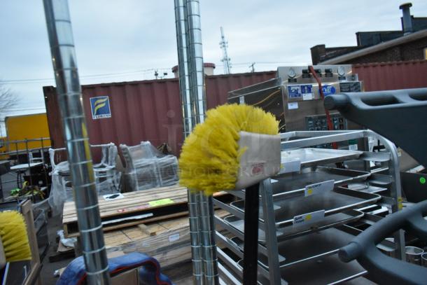 Gray poly trash can with contents including wire shelf and cleaning supplies. Features industrial-grade materials.