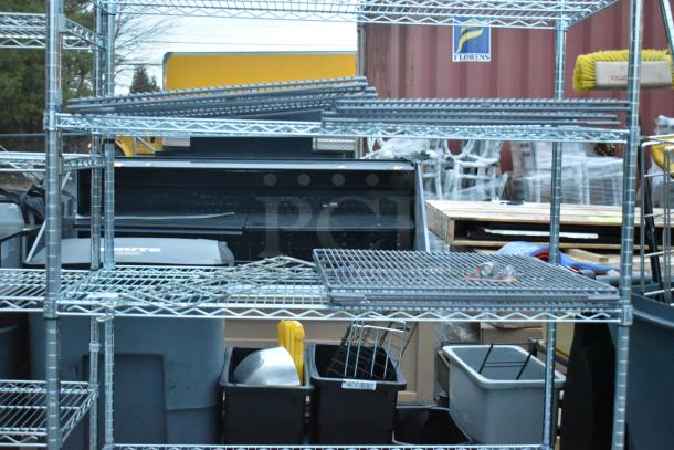 Chrome finish 5-tier wire shelving unit in good condition, partially dismantled. Buyer must dismantle for shipping.