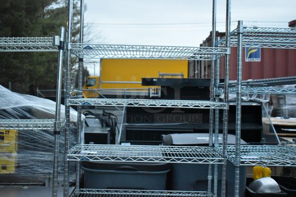 Chrome finish 6-tier wire shelving unit, in used condition. Buyer must dismantle. Consider freight charges.