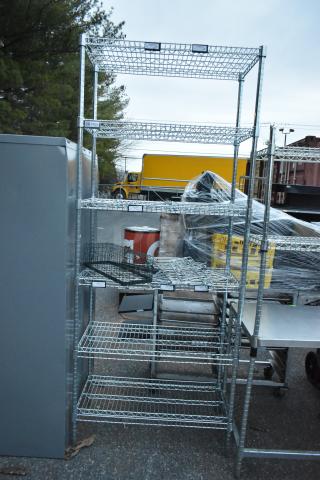 Chrome finish 6-tier wire shelving unit, outdoor setting, minor wear, buyer must dismantle for shipping.