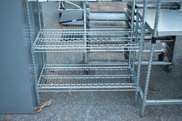 Chrome finish 6-tier wire shelving unit, excellent condition, buyer must dismantle, freight charges apply.