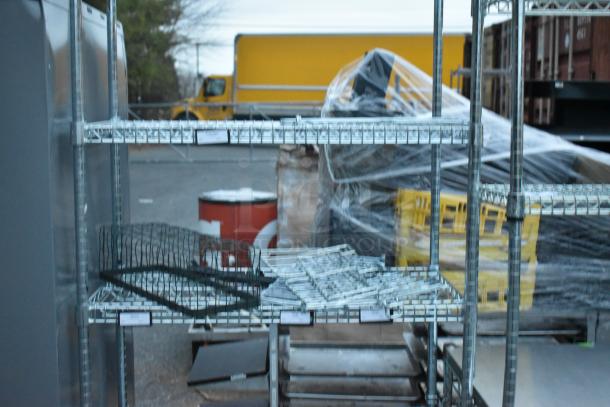 Chrome finish 6-tier wire shelving unit, fully assembled, outdoors. Buyer must dismantle for shipping. Consider freight charges.