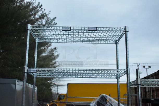 Chrome finish 6 tier wire shelving unit. Condition: used, buyer must dismantle. Freight charges apply. Tags indicate dismantling required.