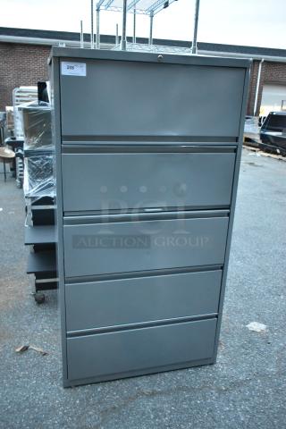 Gray metal filing cabinet with four drawers and one door, in good condition. Tag reads "208".