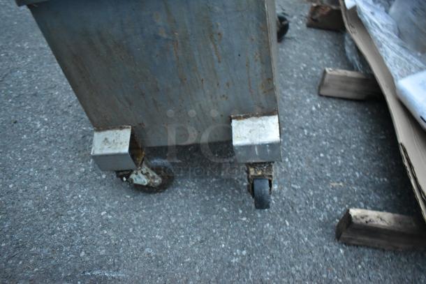 Metal commercial portable fryer oil filter, model 402. Features a 120-volt, 1-phase system. Visible wear on wheels.