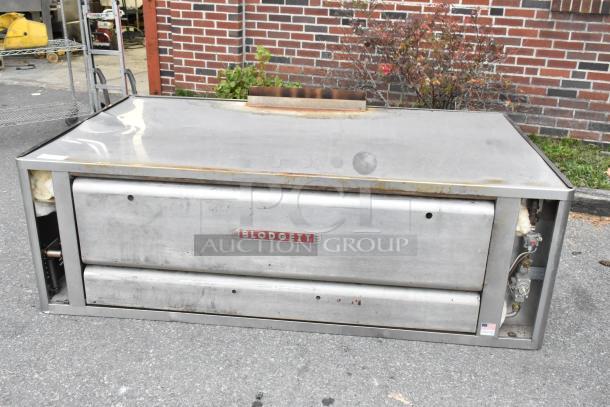 Blodgett 1060B stainless steel commercial propane pizza oven, single deck, 85,000 BTU, visible wear, Blodgett logo on front.