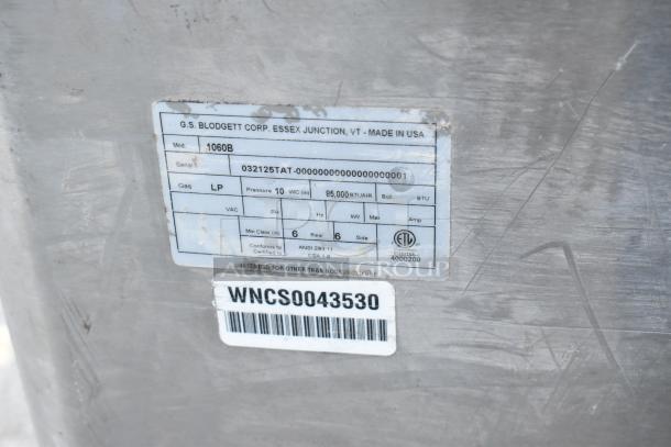 Blodgett 1060B stainless steel commercial pizza oven label, indicating propane fuel, 85,000 BTU, and made in USA.