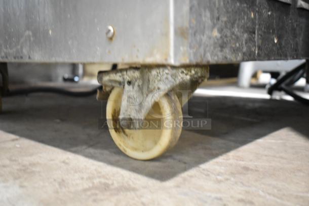 Close-up of Coldelite LB502 commercial batch freezer caster wheel, showing stainless steel construction and heavy-duty design.