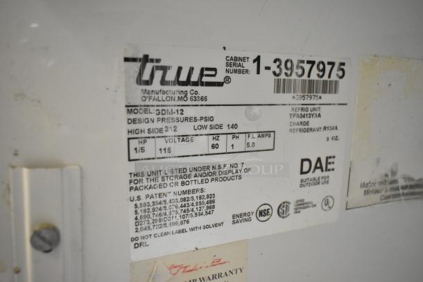 True GDM-12 commercial single door cooler, 115 volts, label showing model, specs, and certifications.