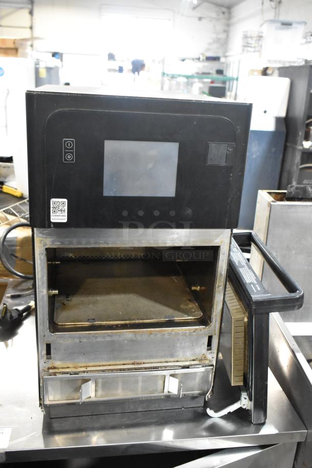 Metal commercial countertop rapid cook oven, door detached, 208/240 volts, 1 phase, touchscreen panel, used condition.