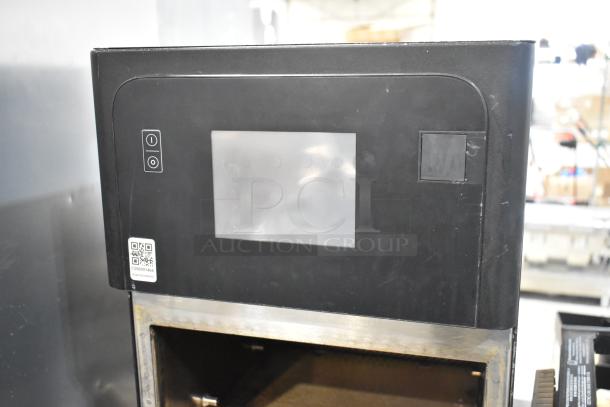 Metal commercial countertop rapid cook oven with detached door, 208/240V, 1 phase. Includes QR code labeled for service.