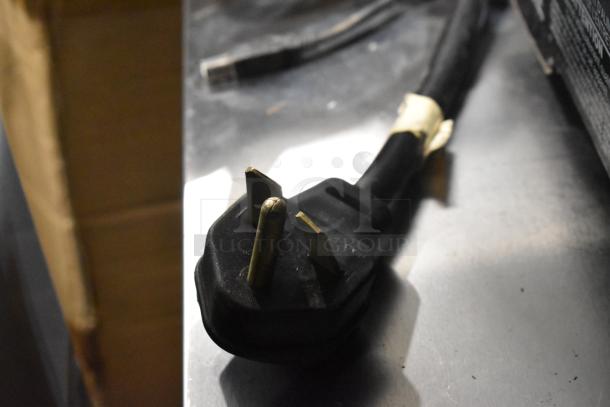 Power cord for metal commercial countertop rapid cook oven. Door needs reattachment. 208/240 volts, 1 phase.