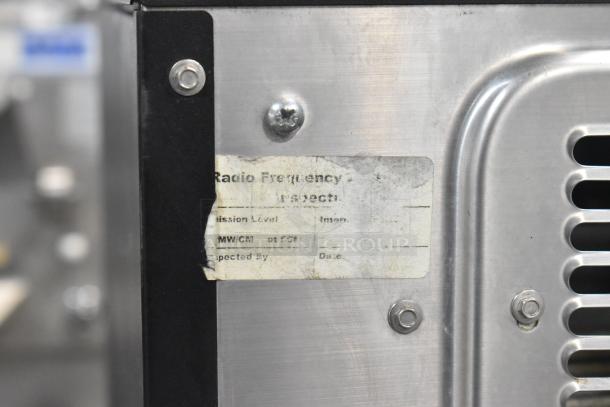 Commercial countertop rapid cook oven, metal, 208/240 volts, 1 phase. Door needs reattachment. Visible wear on label.