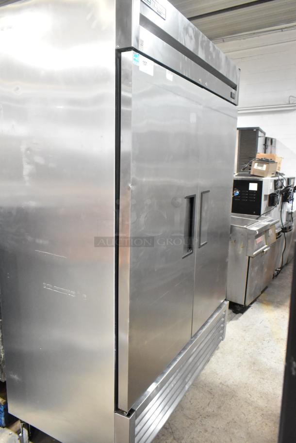 2020 True T-49F-HC stainless steel 2-door commercial freezer with poly-coated racks, on casters. Good condition.