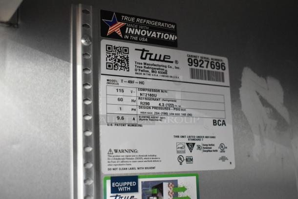 2020 True T-49F-HC freezer label, shows model, voltage, refrigerant details, and NSF certification.