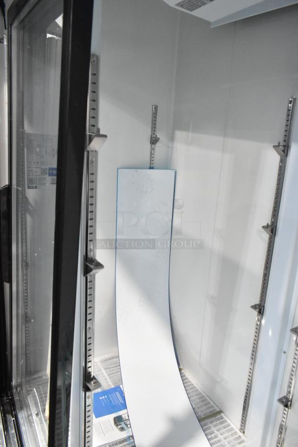 Avantco 178GDS47HCB 53" black commercial merchandiser refrigerator, sliding glass door, LED lighting, poly-coated racks.