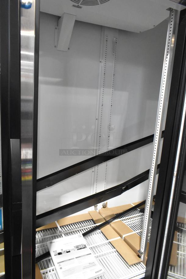 2025 True GDM-72-HC 3-door metal reach-in cooler with poly-coated racks. Includes labels and 115V, 1 phase power.