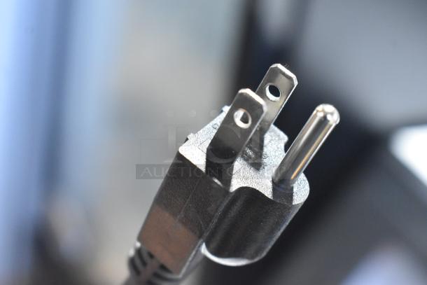 Close-up of a power plug for the 2023 Fetco TBS-2121 Stainless Steel Iced Tea Brewer, 120 Volts, 1 Phase.