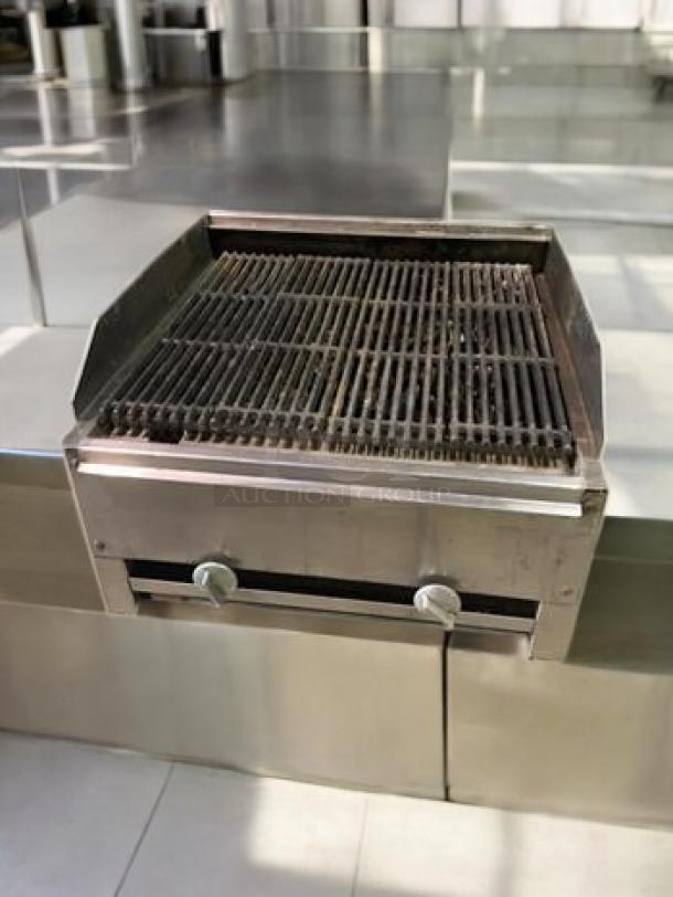 Heavy-duty commercial countertop gas charbroiler, stainless steel build, fully tested, great condition, dual control knobs.