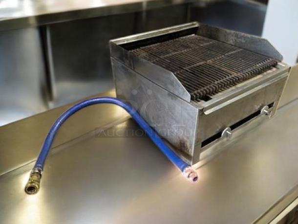 Commercial stainless steel countertop gas charbroiler, heavy-duty, fully tested, excellent condition, includes gas hose.