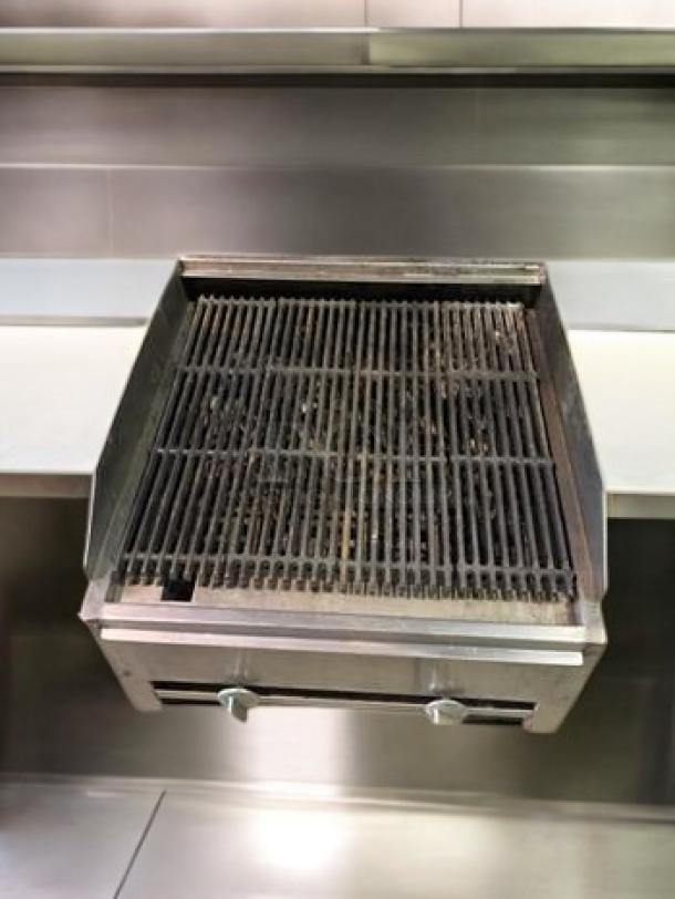 Heavy-duty stainless steel commercial gas charbroiler, countertop model, great condition, fully tested, dual knobs.