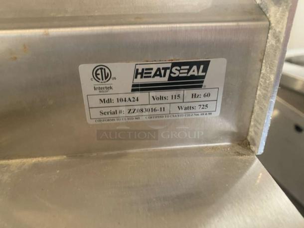 Heat Seal 104A24 industrial heat sealer, exceptional condition, 115V, fully tested. Label shows model, serial number, 725W.