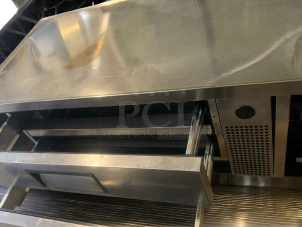 Pristine True TRCB-52-60 refrigerated chef base in stainless steel, 115V, with open drawers, fully tested and working.