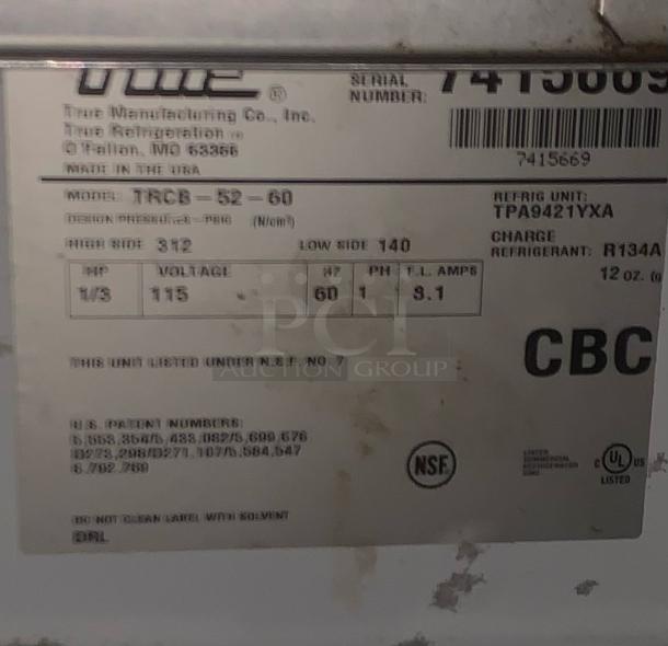 Label on True Manufacturing Co. refrigerated chef base model TRCB-52-60, 115V, made in USA, in pristine condition.