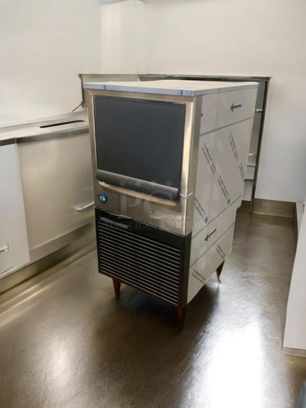 Immaculate Hoshizaki KM-81BAJ undercounter ice maker, 115V, fully tested, silver finish, visible logo, perfect working condition.