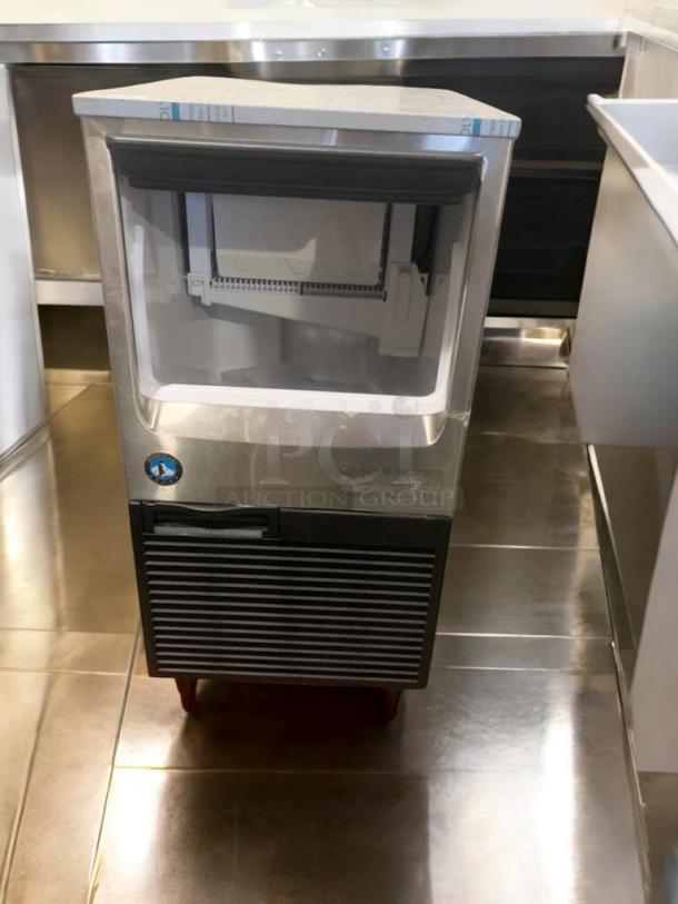 Immaculate Hoshizaki KM-81BAJ undercounter ice maker, 115V, silver finish, fully tested, excellent condition.