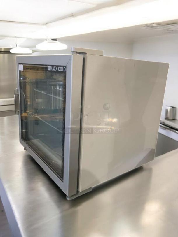 Maxx Cold MXM1-2F countertop freezer, prime condition, 115V, fully tested, featuring glass door and stainless steel finish.