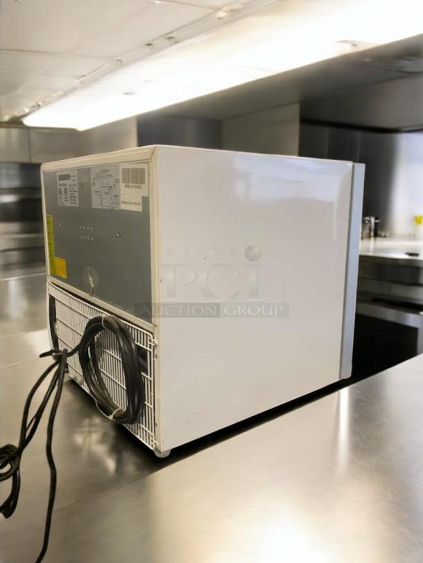 Maxx Cold MXM1-2F countertop freezer, prime condition, 115V, fully tested, rear view showing cords and labels.