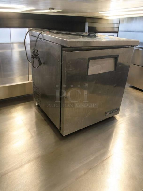 TRUE TWT-27 undercounter refrigerator in prime condition, stainless steel, 115V, fully tested and working, model badge visible.