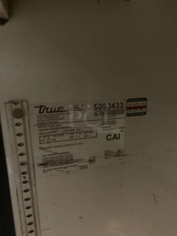 TRUE TWT-27 undercounter refrigerator label, prime condition, 115V, fully tested, TRUE Manufacturing, model details visible.