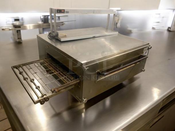 Prime condition XLT Conveyor Pizza Oven, model 3255, natural gas, stainless steel. Fully tested, excellent working order.