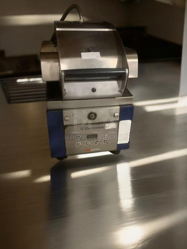 Electrolux HSPPME panini grill in outstanding condition, stainless steel, 208V, fully tested, branded control panel visible.