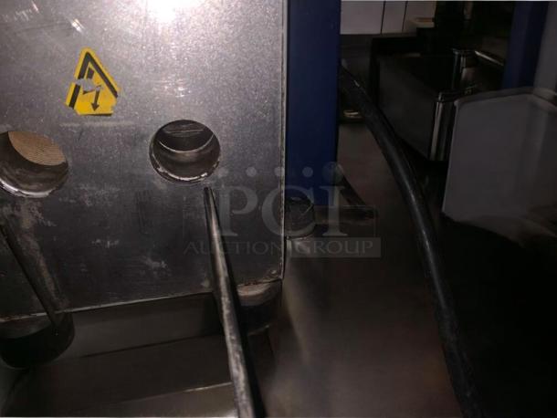 Electrolux HSPPME Panini Grill in outstanding condition, 208V, fully tested. Features durable metal construction, visible caution label.