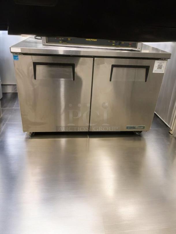 Prime condition True TUC-48-HC undercounter refrigerator, stainless steel, dual door, 115V, fully tested, label visible.