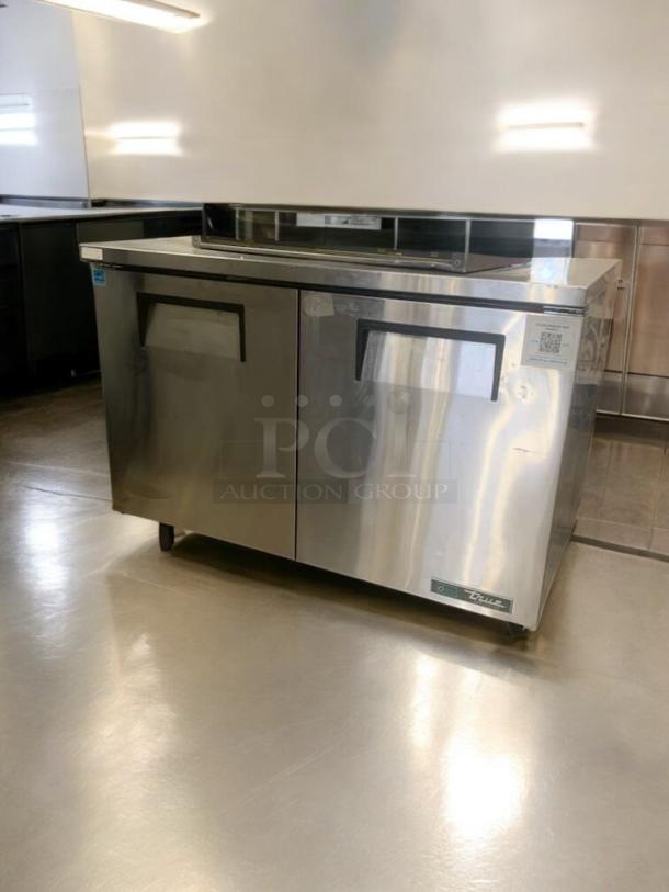 True TUC-48-HC undercounter refrigerator, stainless steel, 115V, prime condition, fully tested, True Manufacturing label visible.